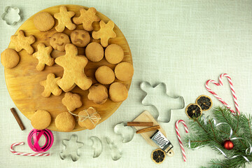 Christmas cookies and cookie cutters on the table