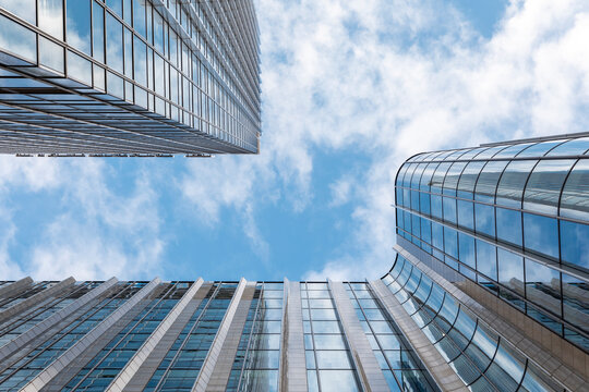 Tall modern office skyscrapers against blue sky, London, UK