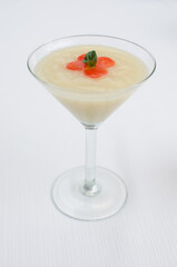 cold white dessert on glass cup