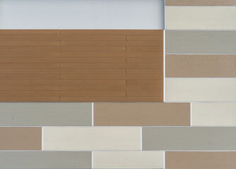 decorative rectangular pattern siding with brick veneer on a new strip mall wall 