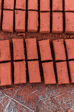 Row of adobe bricks on the floor