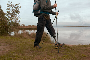 Unrecognizable Disabled Traveller Hiking