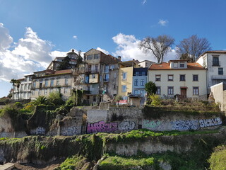 Fototapeta na wymiar Suburban buildings on the edge of a hill, in the stunning city of Porto.