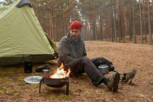 Traveller Burning Charcoal In Portable Roaster - Powered by Adobe