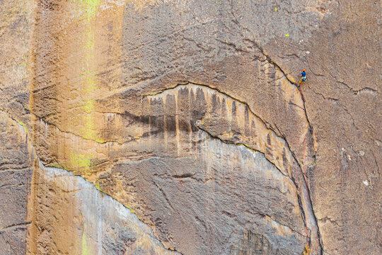 Aerial shot of first on the rope climber on scenic crack on bigwall