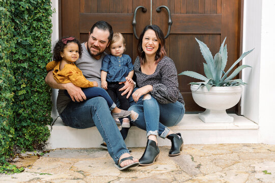 Portrait of mixed-race and adoptive family