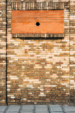 Old brick wall with walled window