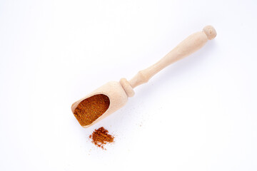 wooden spice scoop isolated on white