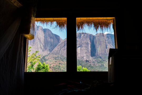 Framed window view of rocky mountain peaks