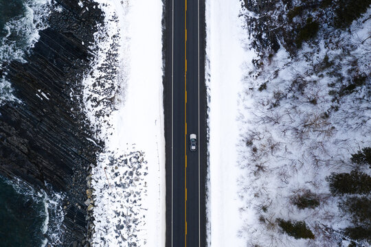car overhead shot along a snowy road