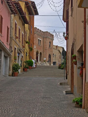 Italy, Marche, Mondolfo, downtown medieval street and steps.