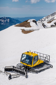 Yellow ratrack on the side of a mountain