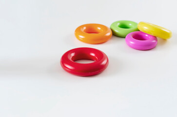 a group of of five colorful plastic rings isolated on a white background.