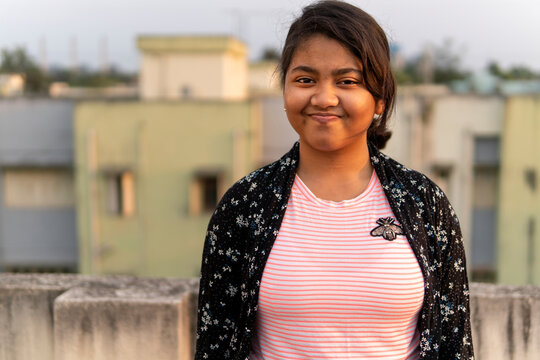 Happy teenage girl portrait at outdoors