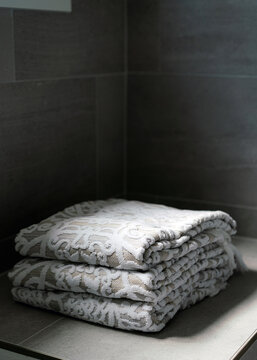 Folded towels in a shower