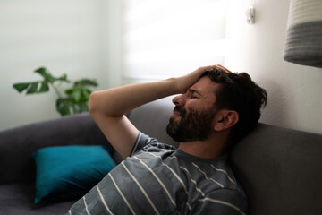 Man in his 30s looking anxious and stressed