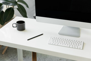 minimal home office with imac in bright organized studio