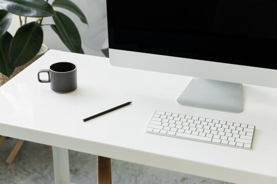 minimal home office with imac in bright organized studio