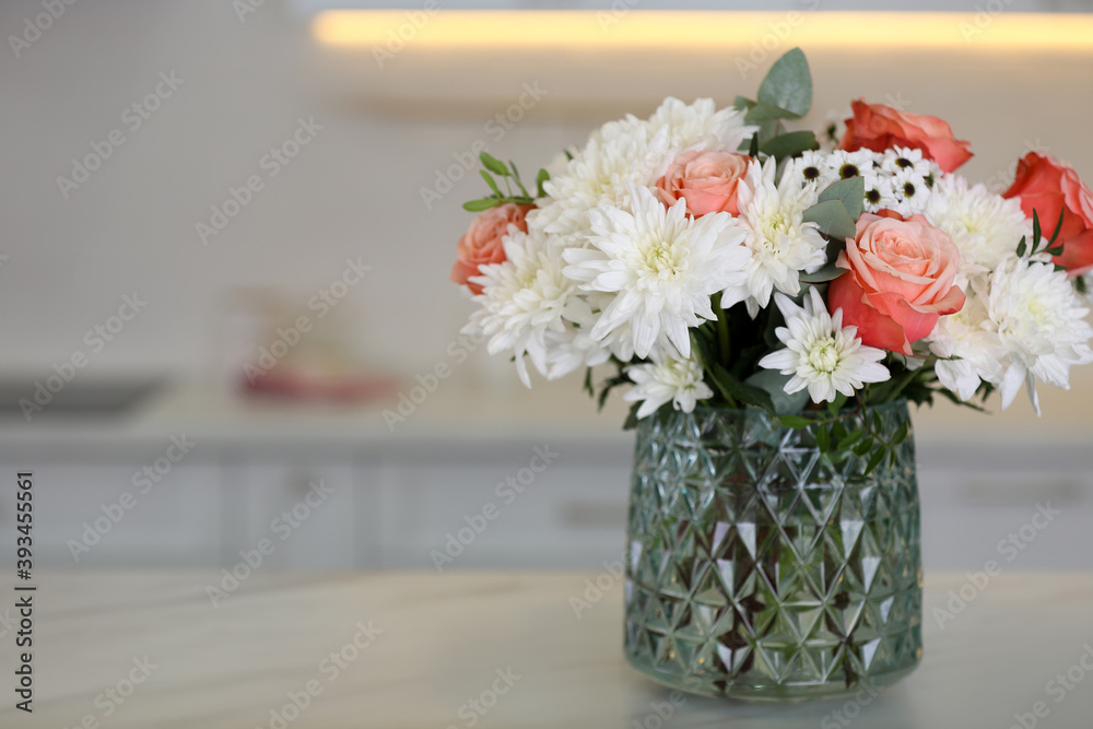 Canvas Prints Vase with beautiful flowers on table in kitchen, space for text. Interior design