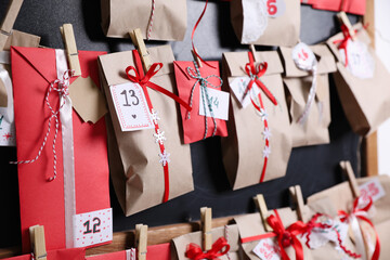 Christmas advent calendar hanging on blackboard, closeup