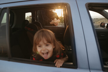 A young family traveling by car.