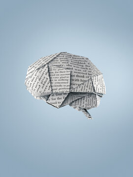 Origami brain made of pages with text