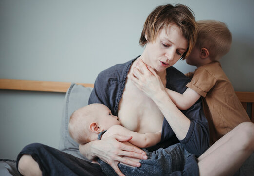 A young mother with her little children.