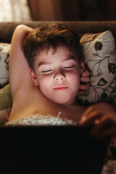 Young boy using tablet.