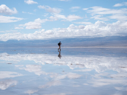 Reflection of man taking pictures.