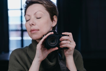 Female photographer with a camera.