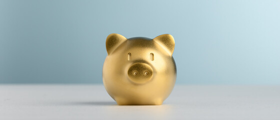 Golden Piggy Bank with blue background for saving and invest concept.