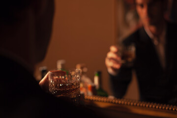 Young man drinking fine whisky