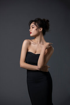 Beautiful young woman in black dress