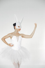 Fototapeta na wymiar Gorgeous ballet dancer. Ballerina in pointe. Girl on a white background.