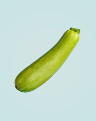 ripe courgettes on a light green background. Vegetarian product. Healthy eating