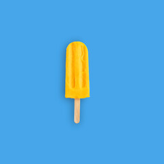 fruit ice cream popsicle on a blue background. creative composition