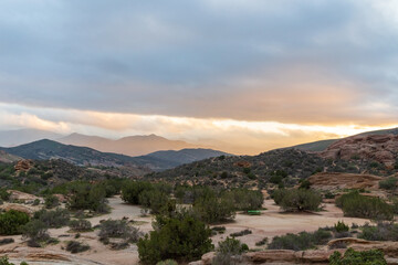 Desert sunset with mountains and clouds at Vasquez Rocks, California