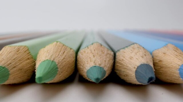 Coloured pencils in a row