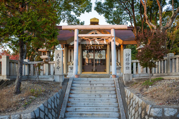 Stairs leading up to empty shrine in late afternoon sun