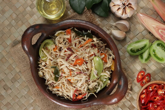 Ayam suir Kecombrang : shredded chicken spicy with kecombrang or honje or kincung fragrant edible flower. Selective focus