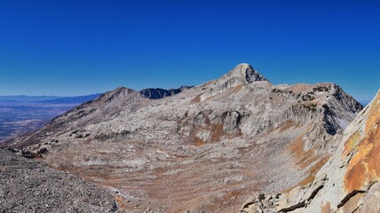 View of Pfeifferhorn peak and Lone Peak Wilderness mountain landscape from White Baldy and Pfeifferhorn trail, towards Salt Lake Valley, Wasatch Rocky mountain range, Utah, United States. 