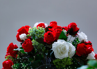 Bouquet of artificial roses arranged for decoration in home, Decorative artificial flowers in vase