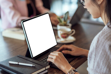 Close up. Graphic designer woman using digital tablet while working.