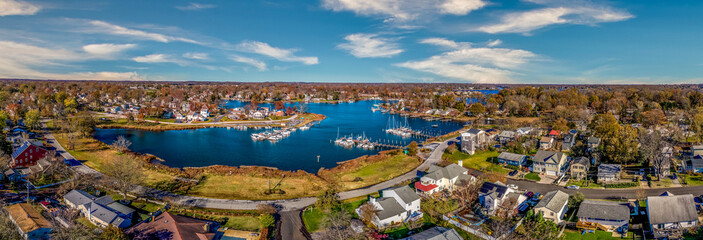 Aerial panorama view of Edgewater Maryland Almshouse Creek South River marina with luxury sail boats turquoise water, popular retirement community near Annapolis