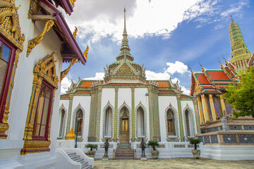 The beautiful inside of the Emerald Buddha Temple with white pavilion with the sky, is an important Buddhist temple and a famous tourist destination in Bangkok, Thailand