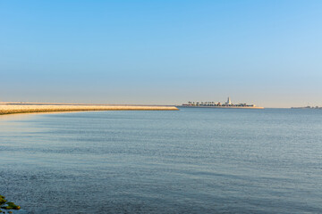 Blue sea and island with blue sky in the morning at the corniche park in Dammam, Kingdom of Saudi Arabia