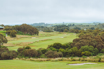 Fototapeta na wymiar landscape of golf course with cloudy sky 