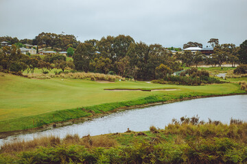 Fototapeta na wymiar golf hole over water lake dam 