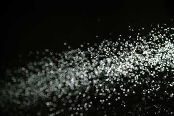 Abstract white bokeh with black background