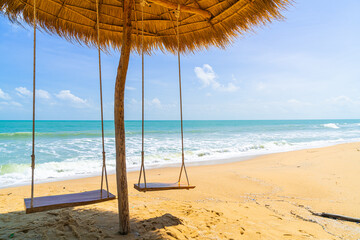 swing on beach with ocean sea background